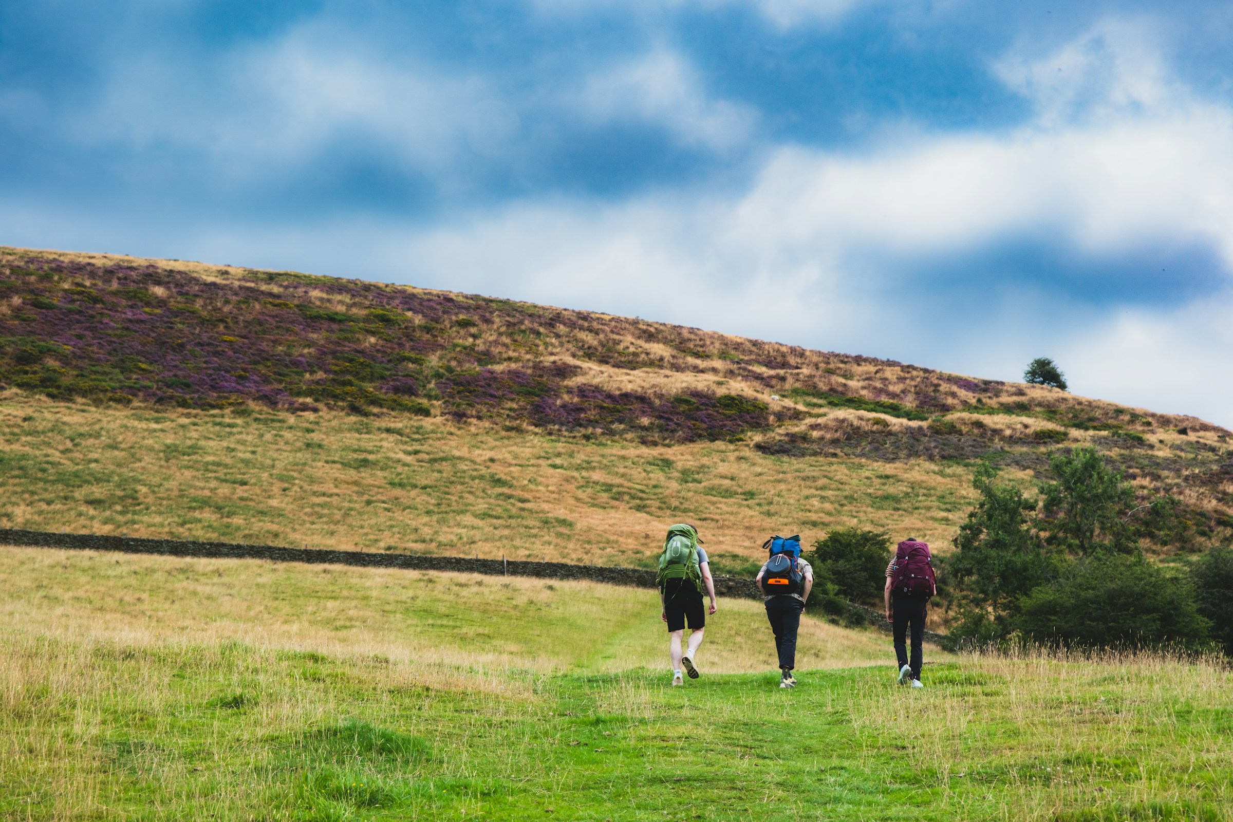 Walkers hiking in the Peak District near Win Hill